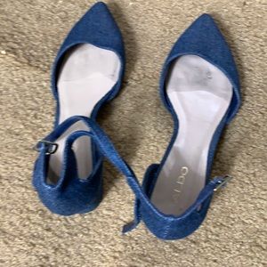 Jeans material blue flats with a little 1 1/2 inch heel. Aldo brand.